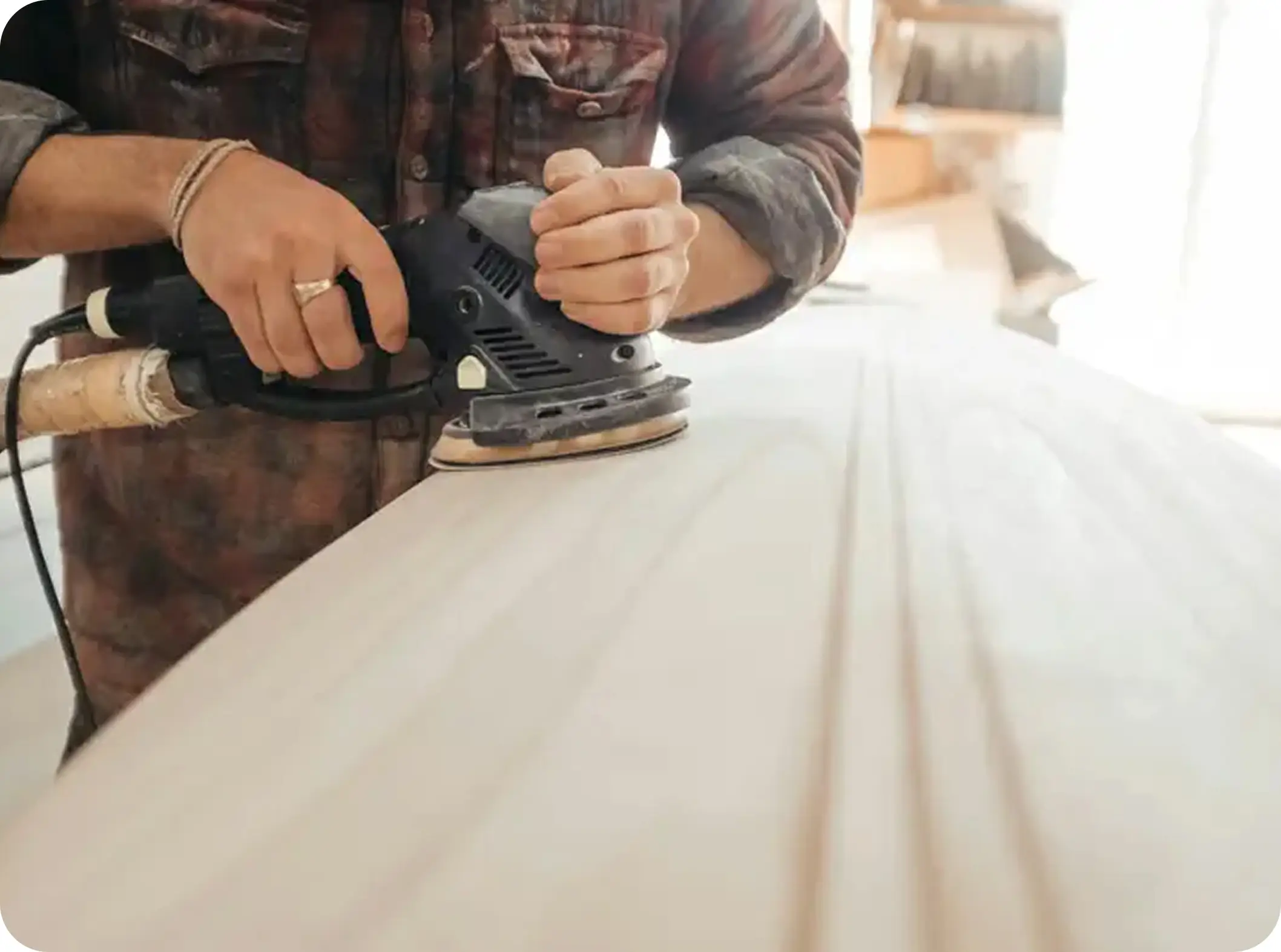 a person using a sander indoors