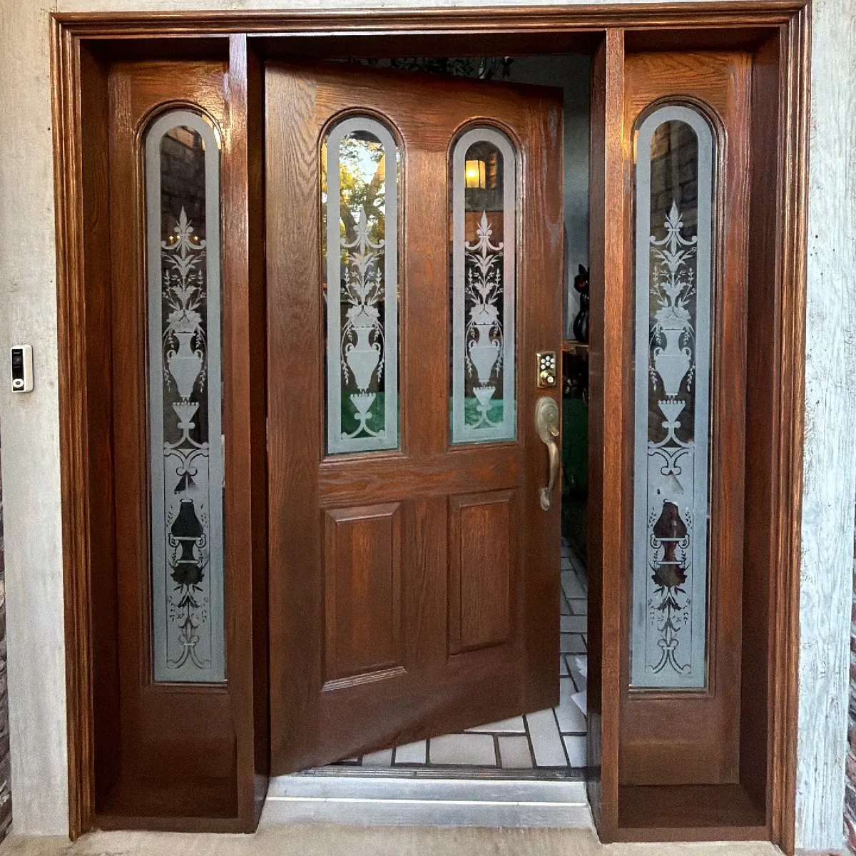 Oak front door and sidelights fully stained and refinished by HomePro Handyman in Tulsa
